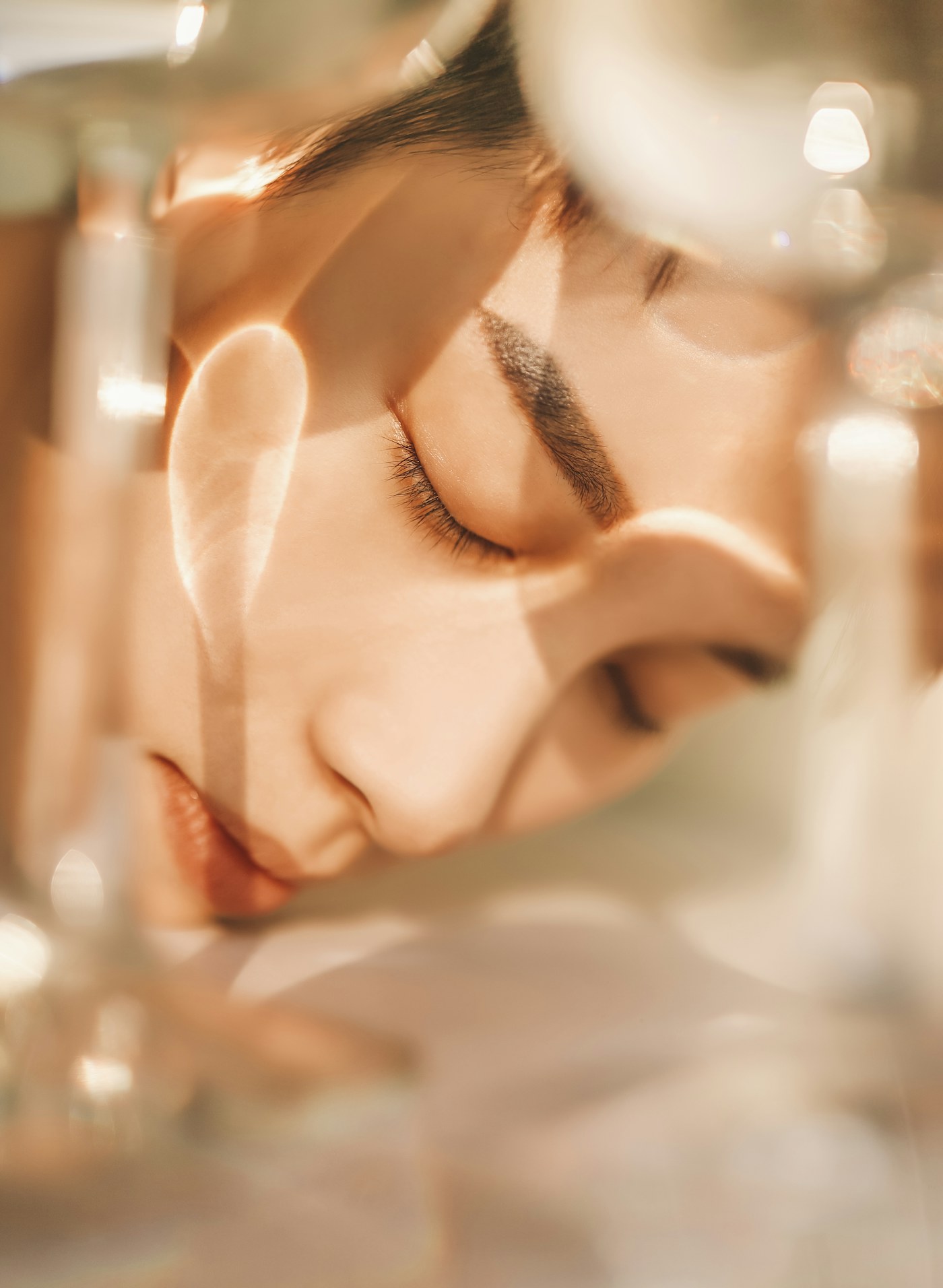 Serene face reflected through soft warm light